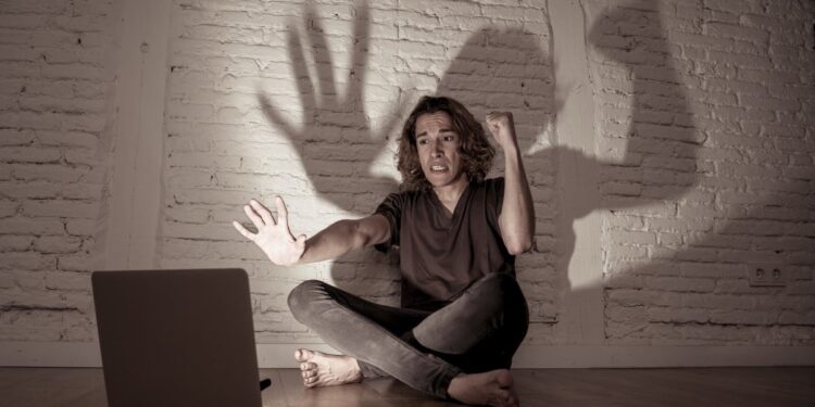 Shutterstock angry and afraid of laptop.jpg