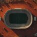 Lucid origin aerial photograph of a soccer stadium surrounded by dry red earth faded chalk li 0.jpg